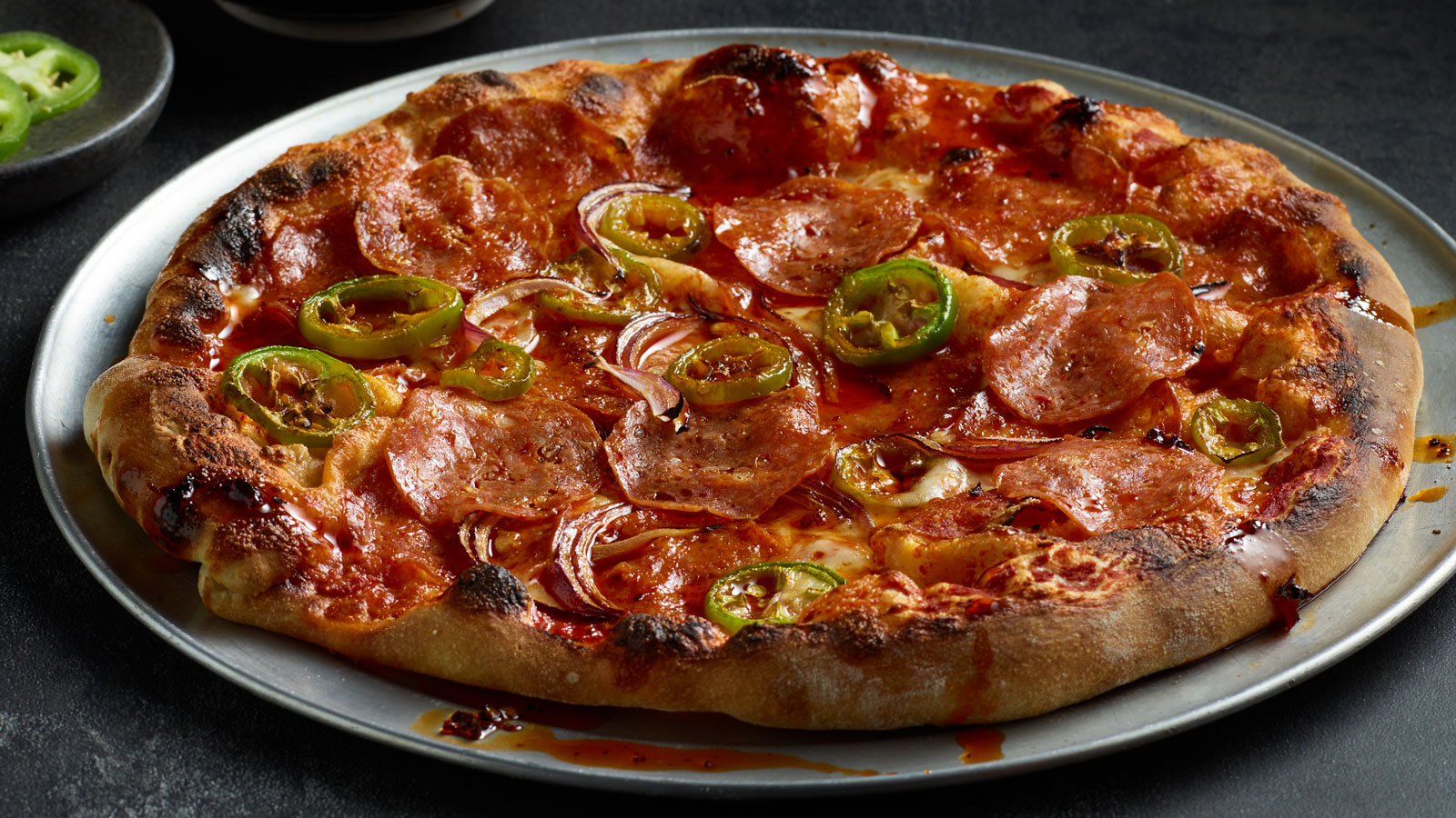 Hot Sopressata, Red Onion and Jalapeno Pizza with Hot Chili Oil and Honey